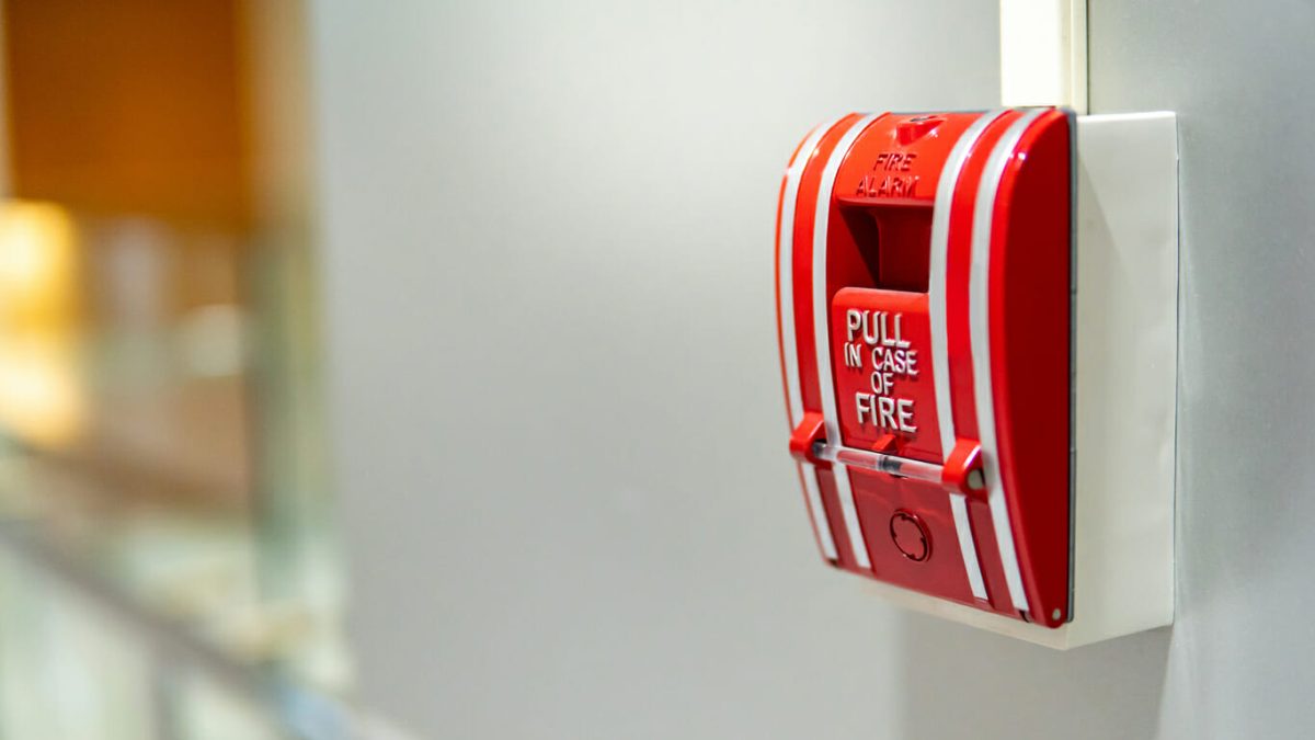 How do condo communities handle fire alarm system maintenance?